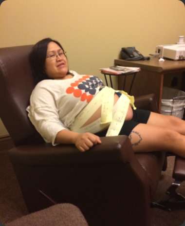Jen sitting while getting fetal monitoring